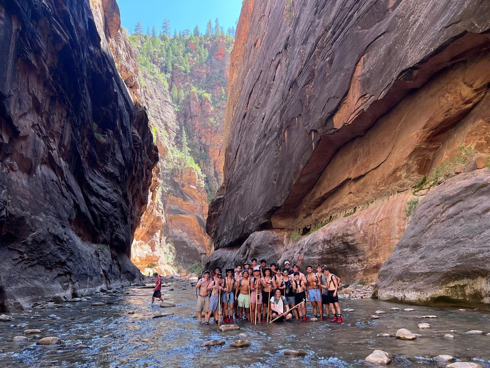 Camp Shepsala group standing together in a narrow canyon